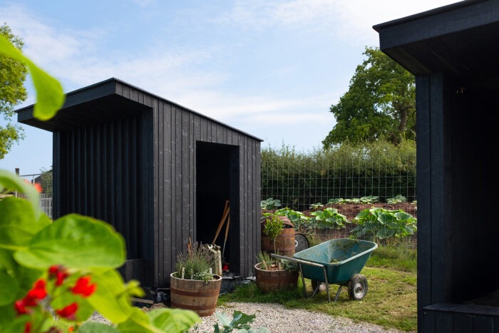 Potting shed with wheelbarrow