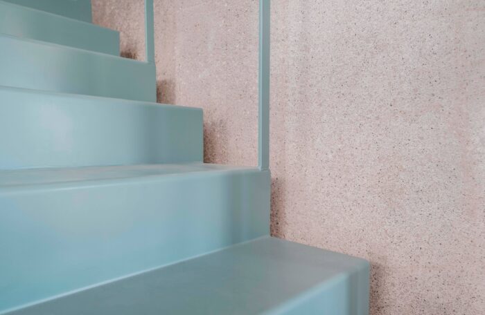 These beautiful blue stairs are made from folded steel. Architect Rob Elkins describes craning them into place through the barn roof as one of the build's biggest challenges.