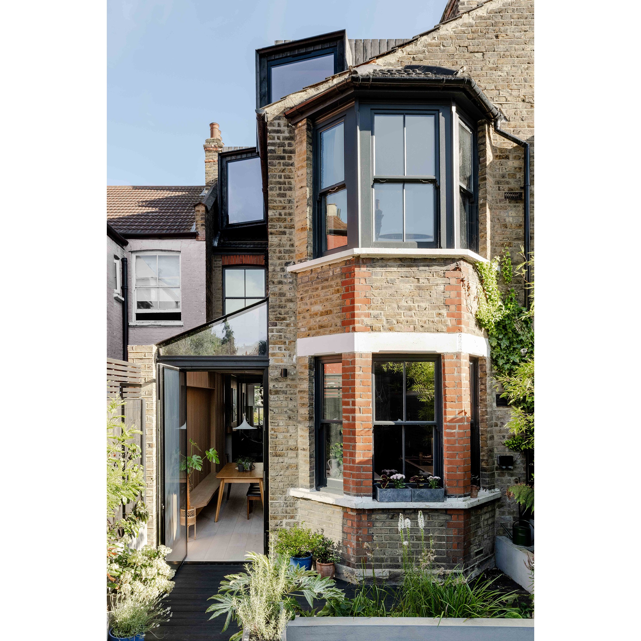 The rear of Dom French's house with two bay windows