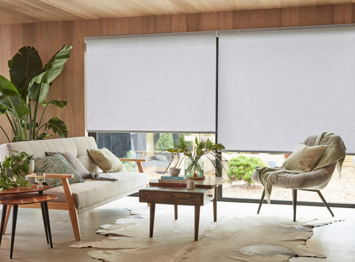 A stylish modern lounge with electric blinds