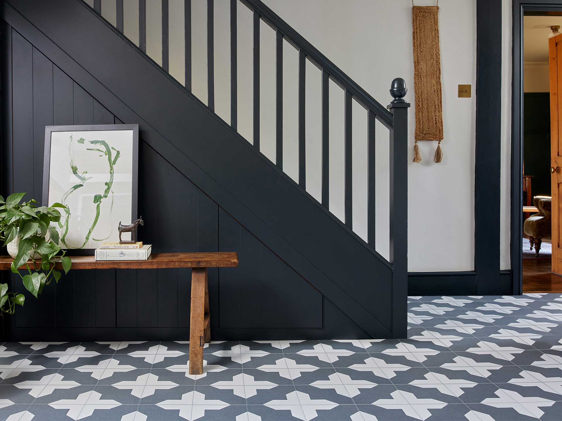 The stair decorating idea of painting the bannisters black will bring a dramatic update