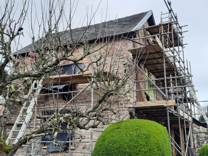 The house covered in scaffolding 