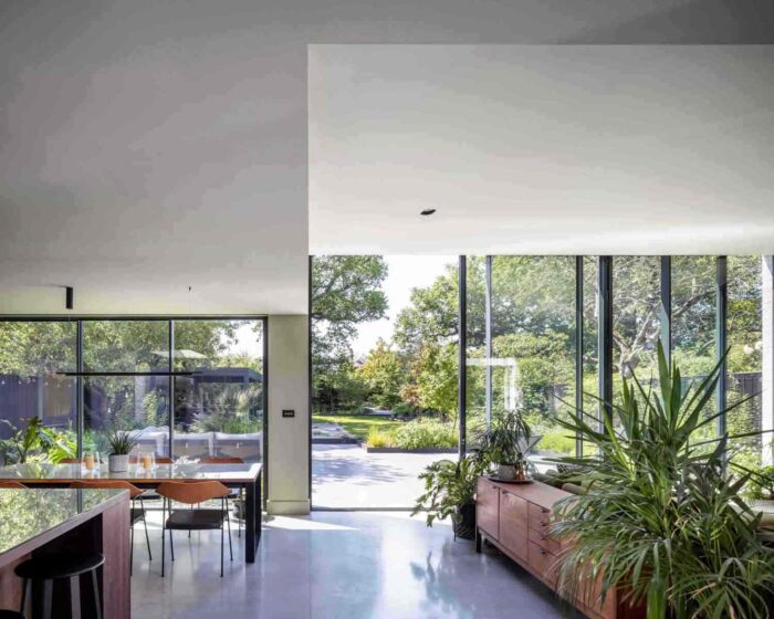 View through the house, inlcuding the new kitchen and dining room in the extension, to the back garden. Large 3m high glazed door give access to the outdoors.