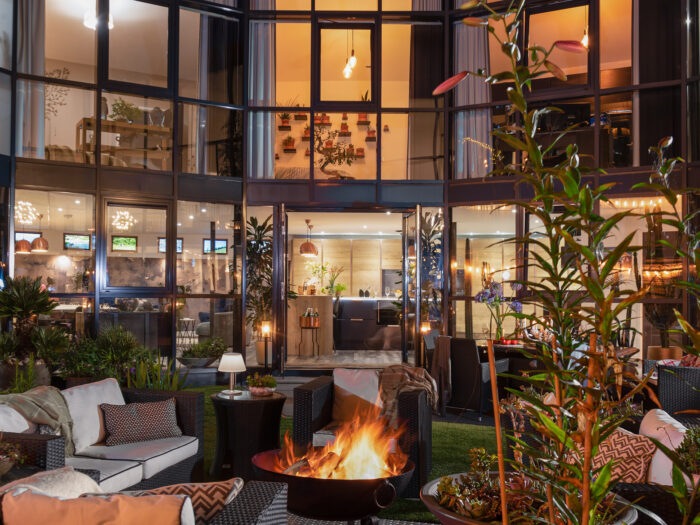 Woolbrook reservoir central courtyard at night with fire pit